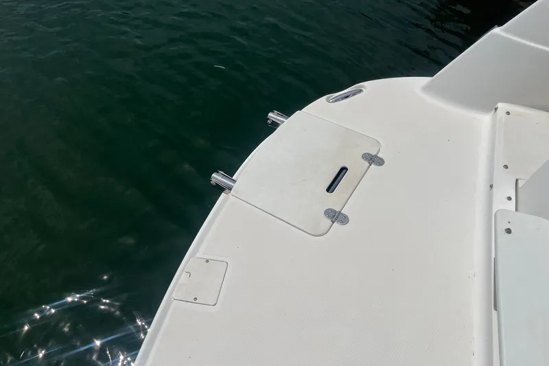 Slide: The Image of 2007 Rinker 280 Express Cruiser swim platform with water backdrop. - 23