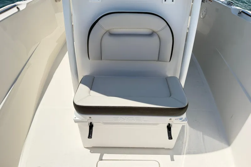 Slide: The Image of 2021 Sailfish 290 CC boat seat with integrated cooler on deck. - 24