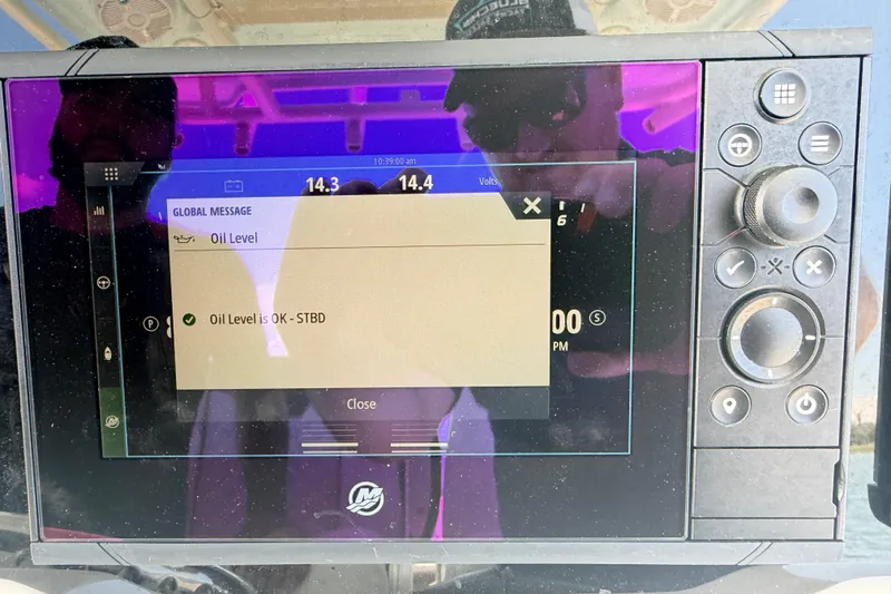Slide: The Image of Boat dashboard display showing oil level status on Sailfish 290 CC, 2021 model. - 28