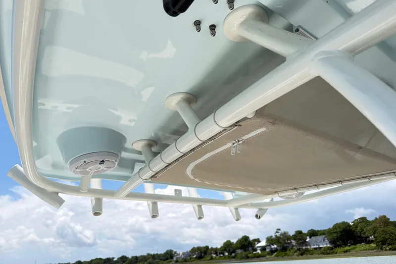 Slide: The Image of 2021 Sailfish 290 CC boat underside view with speaker and storage net. - 32