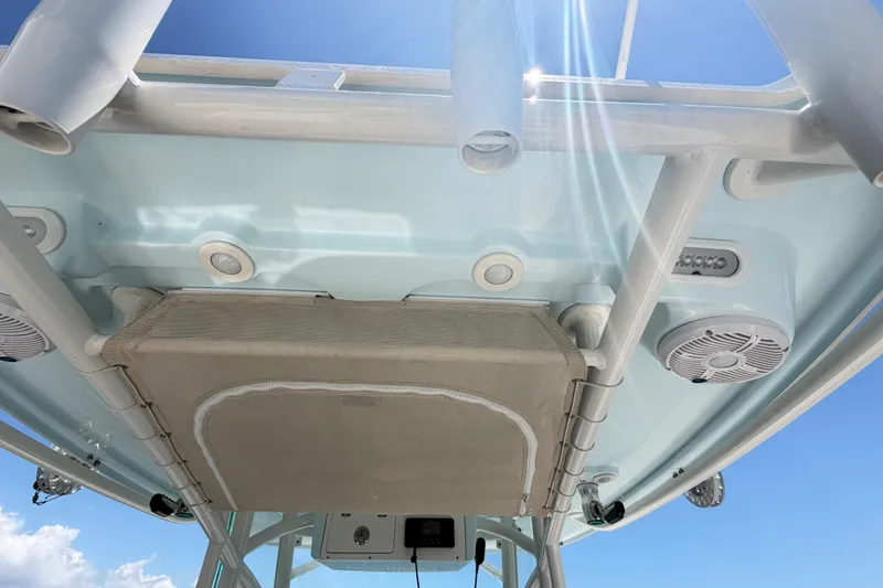 Slide: The Image of 2021 Sailfish 290 CC boat's underside view with speakers and rod holders. - 39