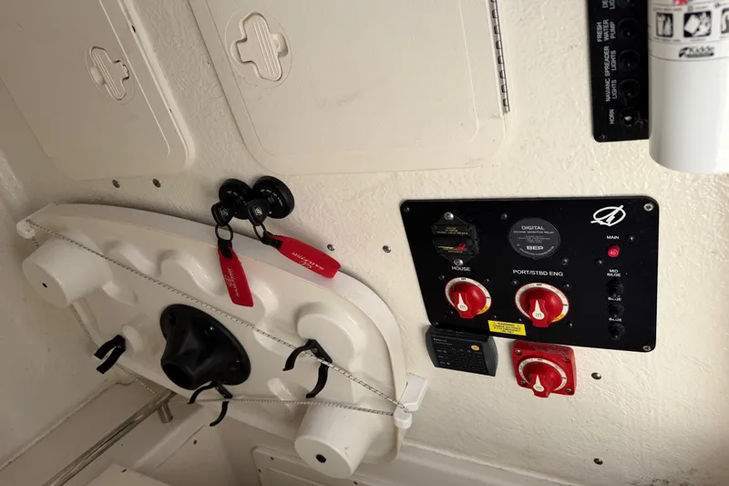 Slide: The Image of Control panel of a 2021 Sailfish 290 CC boat with switches and keys. - 45