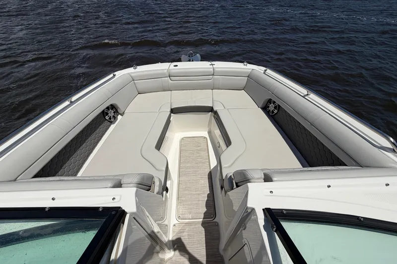 Slide: The Image of 2024 Sea Ray SDX 270 Outboard boat interior with spacious seating on water. - 12