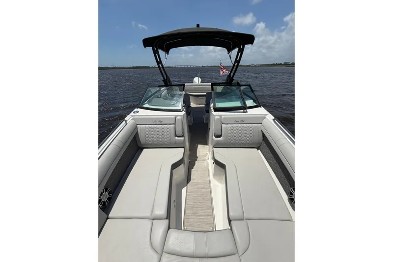 Slide: The Image of 2024 Sea Ray SDX 270 Outboard boat interior with luxurious seating on a sunny day. - 13
