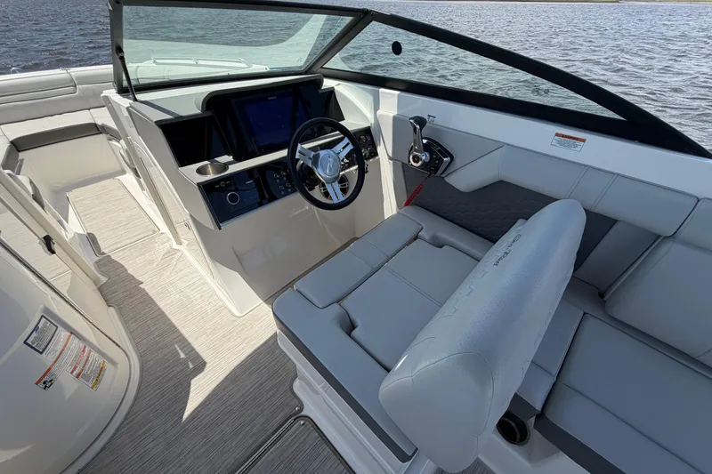 Slide: The Image of 2024 Sea Ray SDX 270 Outboard boat interior with modern helm and seating. - 14