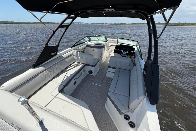 Slide: The Image of 2024 Sea Ray SDX 270 Outboard boat interior with spacious seating on open water. - 16