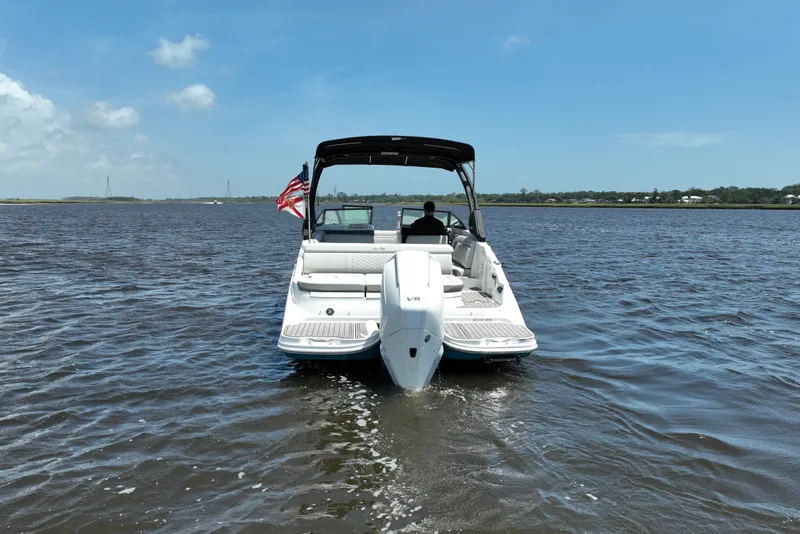 Slide: The Image of 2024 Sea Ray SDX 270 Outboard boat cruising on a sunny day. - 5
