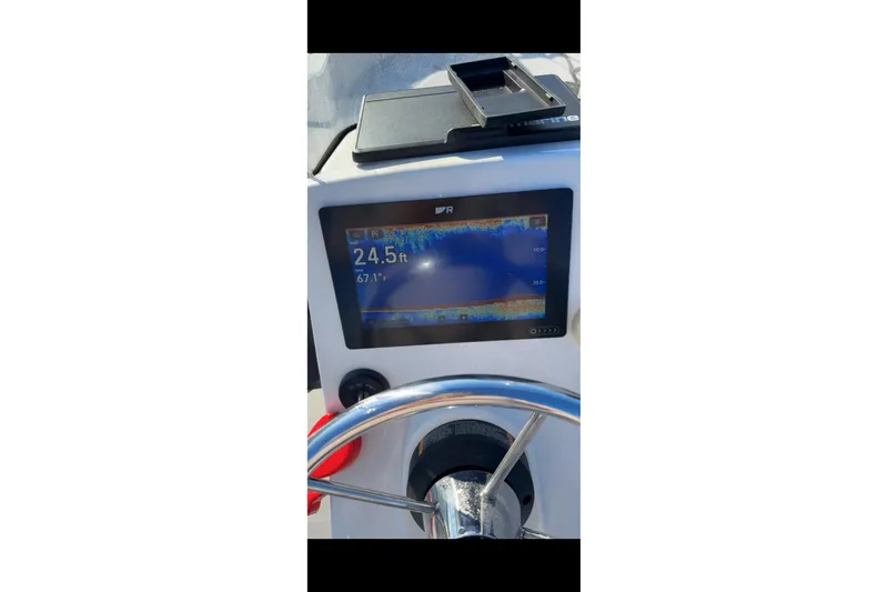 Slide: The Image of Control panel of a 2019 Boston Whaler 150 Montauk boat with depth display. - 22