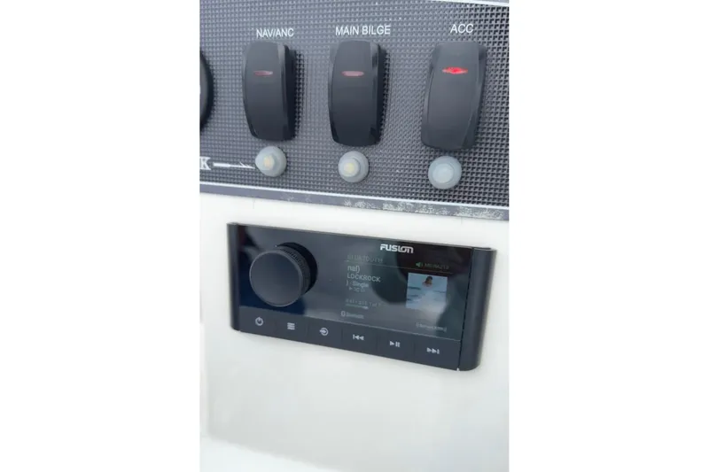 Slide: The Image of Control panel of a 2019 Boston Whaler 150 Montauk boat with audio system. - 27