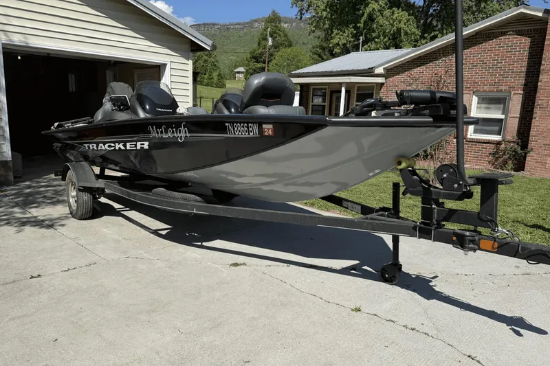The Image of 2023 Tracker Pro Team 175 TX boat on trailer in driveway. - 0