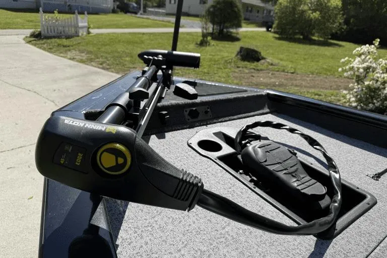 Slide: The Image of 2023 Tracker Pro Team 175 TX boat with Minn Kota trolling motor on deck. - 9