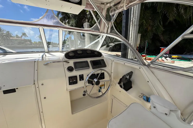 Slide: The Image of 2003 World Cat 270 EC boat cockpit with steering wheel and control panel. - 10
