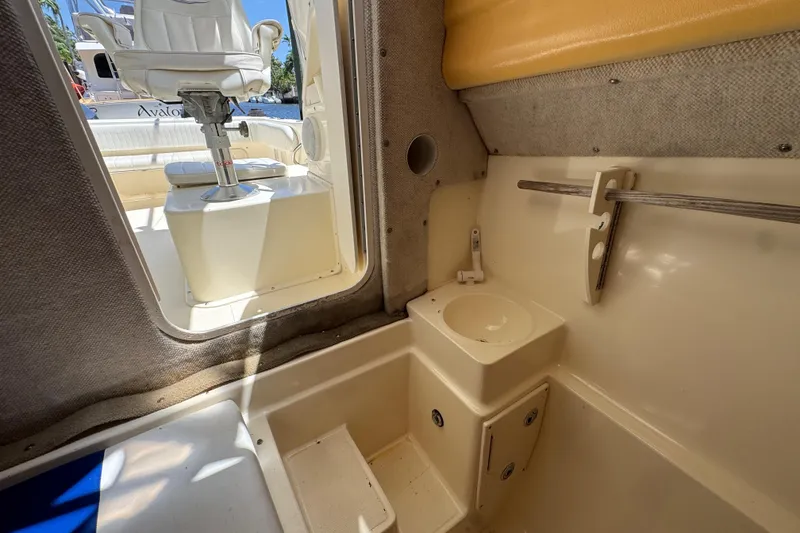 Slide: The Image of 2003 World Cat 270 EC interior cabin with sink and seating area. - 22