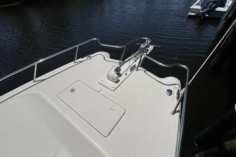 Slide: The Image of Bow of 2003 World Cat 270 EC boat with anchor and railing. - 25