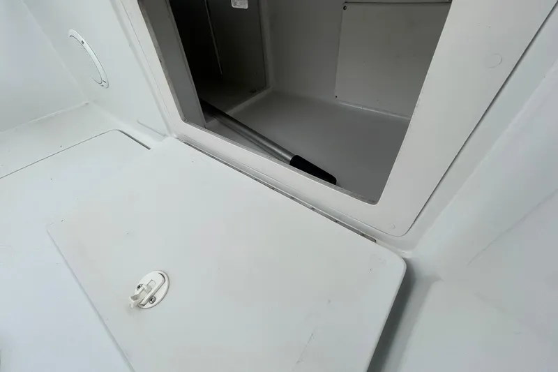 Slide: The Image of Storage compartment on a 1996 Luhrs Tournament 290 Open boat. - 28