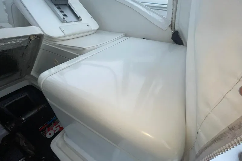 Slide: The Image of Interior view of a 1996 Luhrs Tournament 290 Open boat, showcasing seating and storage. - 30