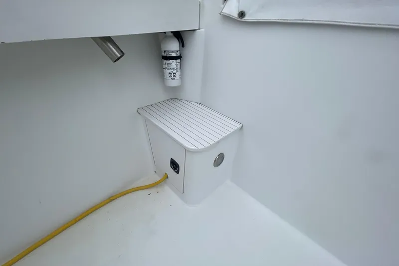 Slide: The Image of 1996 Luhrs Tournament 290 Open boat interior with fire extinguisher and electrical outlet. - 40
