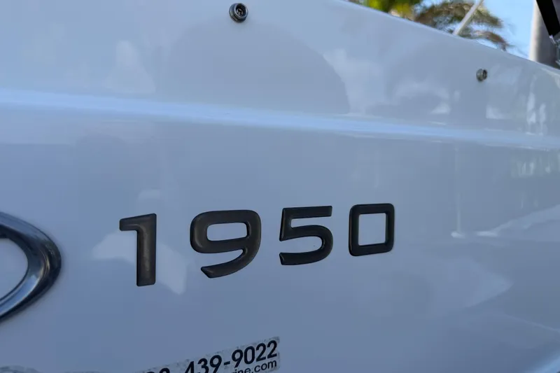 Slide: The Image of Close-up of Tahoe 1950 model emblem on a white surface, 2021. - 4