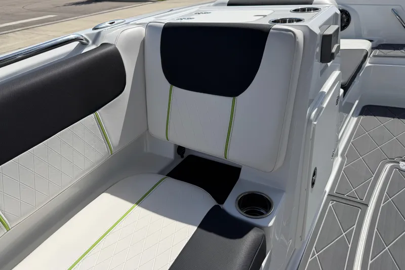 Slide: The Image of Interior seating of a 2021 Tahoe 1950 boat with cup holders and stylish upholstery. - 90