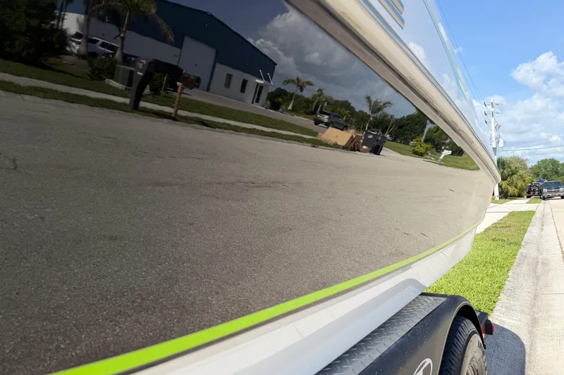 Slide: The Image of Shiny Tahoe 1950 boat reflecting street scene, 2021 model. - 33