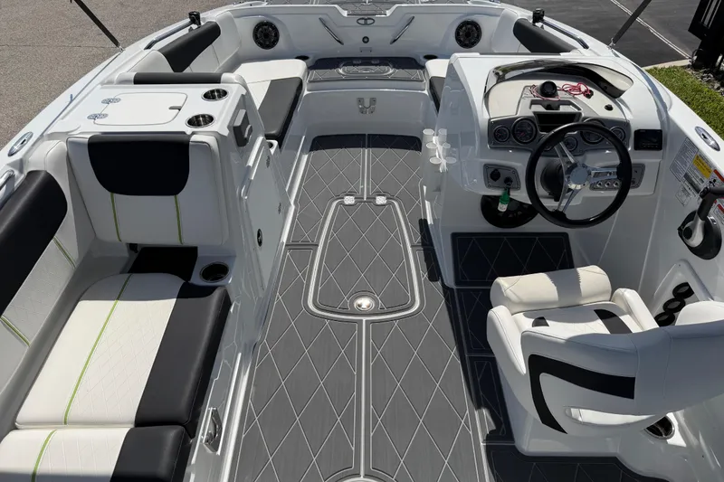 Slide: The Image of Modern 2021 Tahoe 1950 boat interior with sleek seating and steering console. - 39