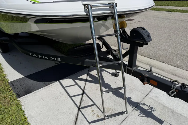 Slide: The Image of Boat trailer with ladder, Tahoe 1950 model, 2021, parked on concrete driveway. - 22
