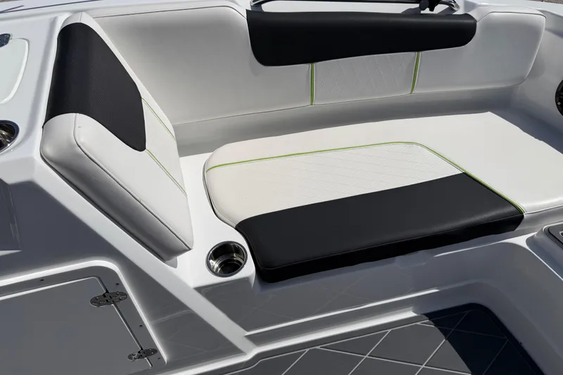 Slide: The Image of Interior seating of a 2021 Tahoe 1950 boat, featuring black and white upholstery. - 58