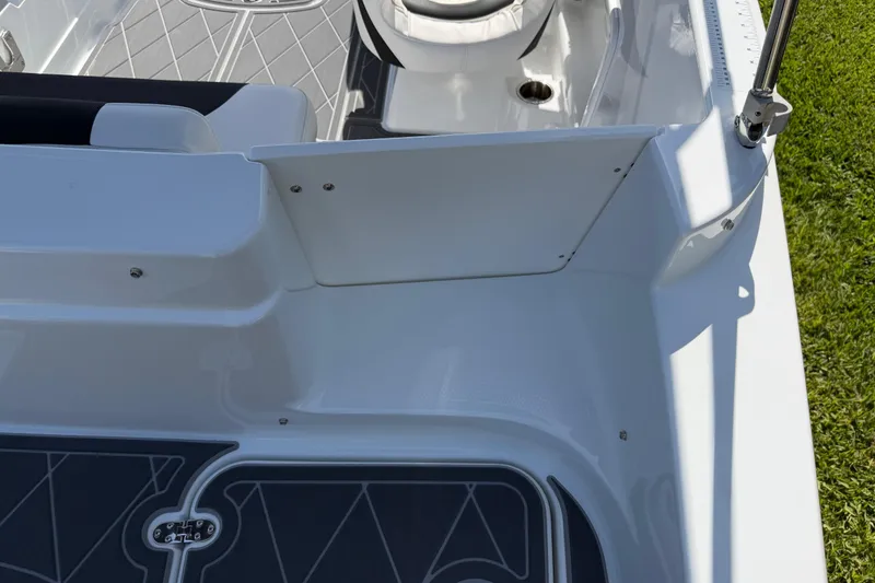 Slide: The Image of Interior view of a 2021 Tahoe 1950 boat, featuring sleek white seating and flooring. - 36
