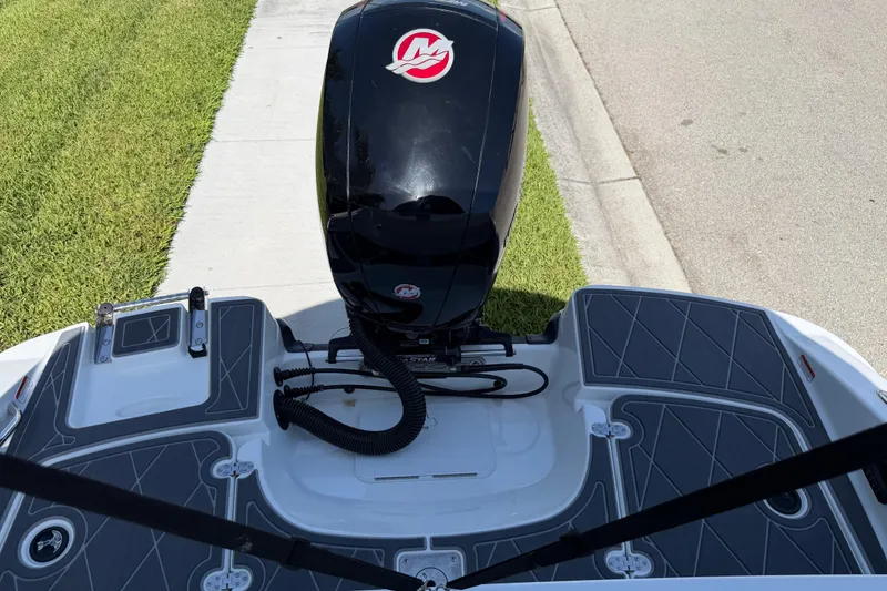 Slide: The Image of Tahoe 1950 boat, 2021 model, with outboard motor on a sunny day. - 95