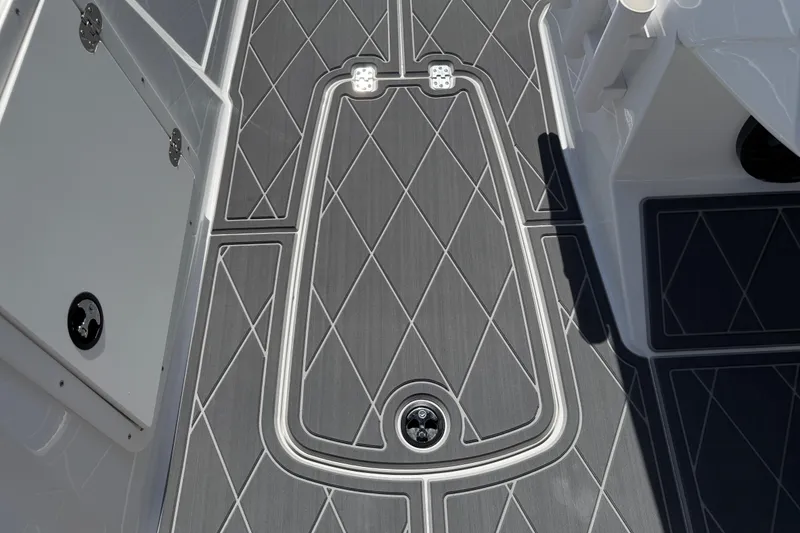 Slide: The Image of Gray deck flooring on a 2021 Tahoe 1950 boat, featuring diamond patterns and sleek design. - 82