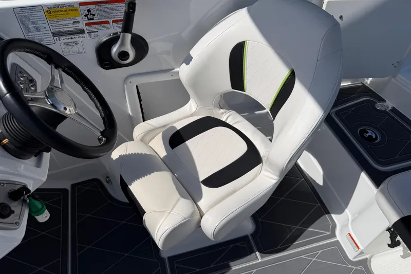 Slide: The Image of Captain's seat and steering wheel of a 2021 Tahoe 1950 boat, featuring modern design. - 54