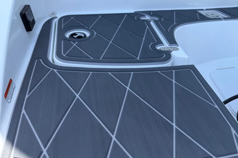 Slide: The Image of Gray deck flooring on a 2021 Tahoe 1950 boat, featuring geometric patterns. - 5