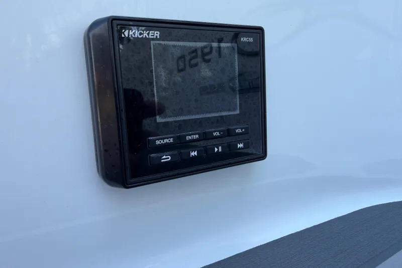 Slide: The Image of Kicker KRC55 audio control panel on a 2021 Tahoe 1950 boat. - 6