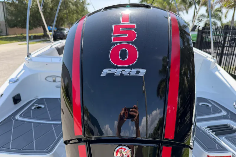 Slide: The Image of Outboard motor on a 2021 Tahoe 1950 boat, featuring "150 PRO" branding. - 11
