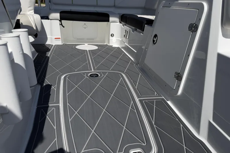 Slide: The Image of Interior view of a 2021 Tahoe 1950 boat with sleek gray flooring. - 72