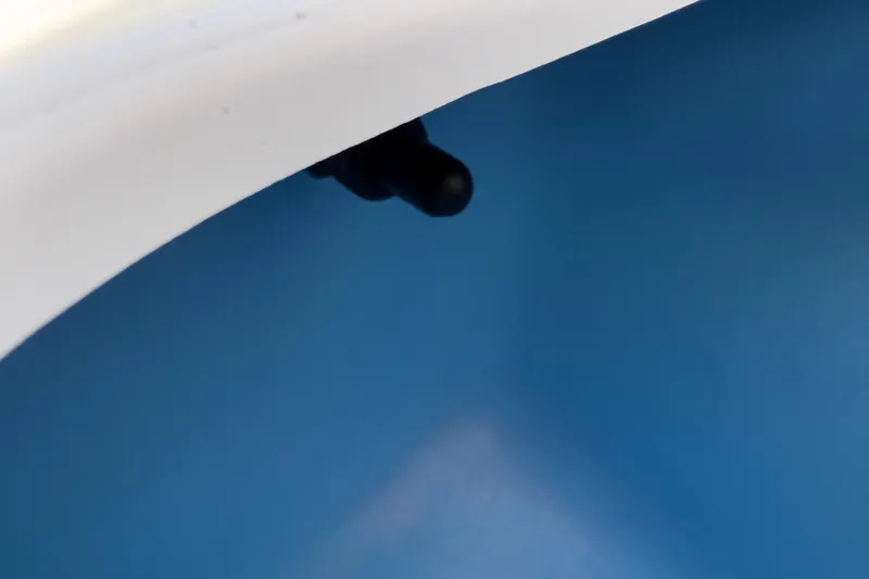 Slide: The Image of Close-up of a Tahoe 1950 boat detail, featuring a blue and white surface, 2021 model. - 63