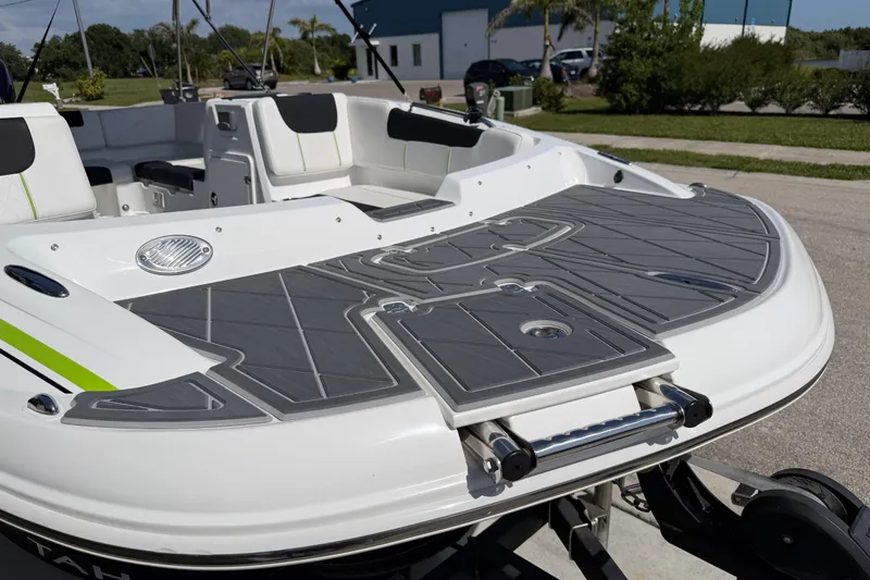 Slide: The Image of Rear view of a 2021 Tahoe 1950 boat with sleek seating and swim platform. - 21