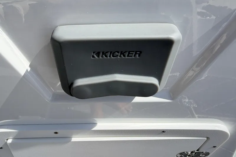 Slide: The Image of Kicker speaker cover on 2021 Tahoe 1950 boat exterior. - 76