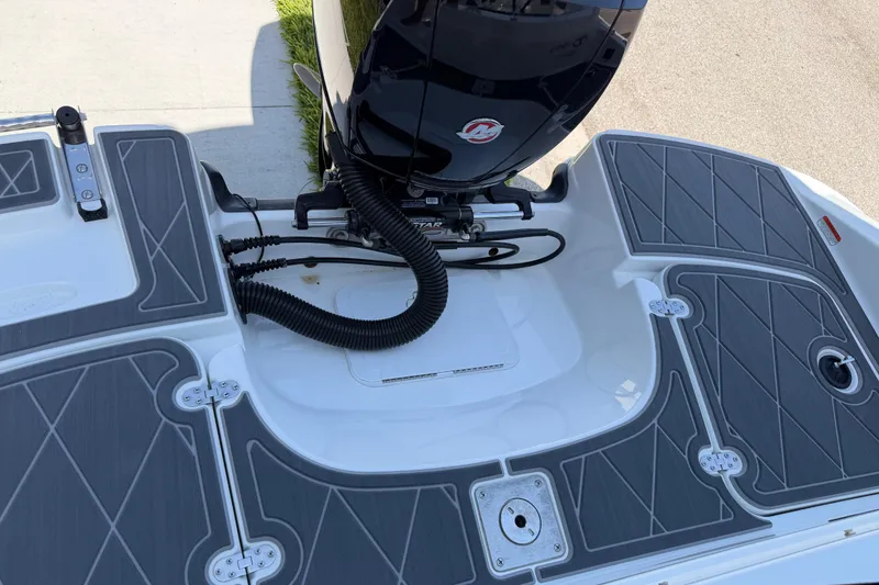 Slide: The Image of Tahoe 1950 boat deck, 2021 model, featuring sleek design and modern outboard motor. - 98