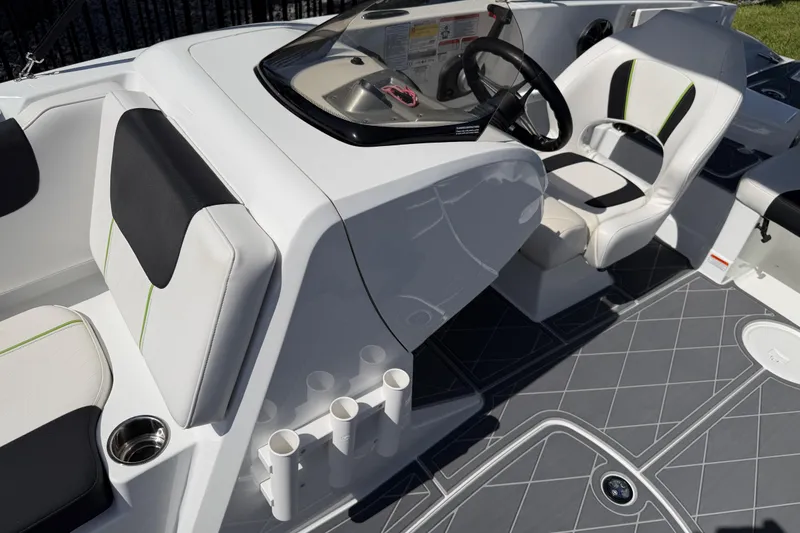 Slide: The Image of Cockpit of a 2021 Tahoe 1950 boat with modern seating and steering wheel. - 93