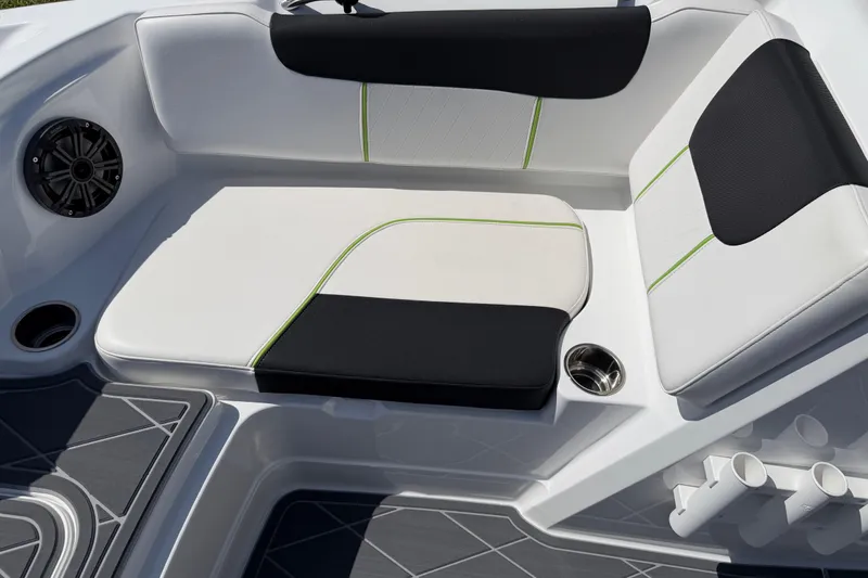 Slide: The Image of Modern boat seating with black and white upholstery, featuring green accents and cup holders. Tahoe 1950, 2021 model. - 57