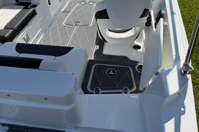 Slide: The Image of Interior of a 2021 Tahoe 1950 boat featuring sleek seating and modern flooring design. - 37