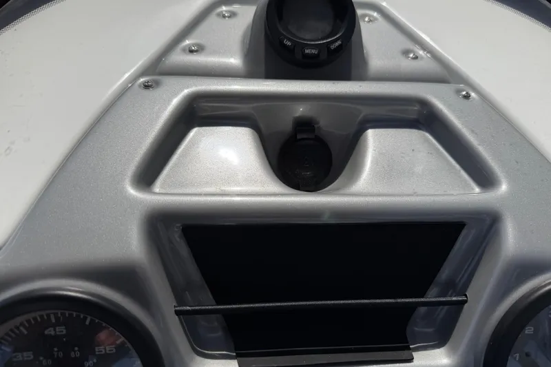 Slide: The Image of Dashboard of a 2021 Tahoe 1950 boat with control panel and gauges. - 51