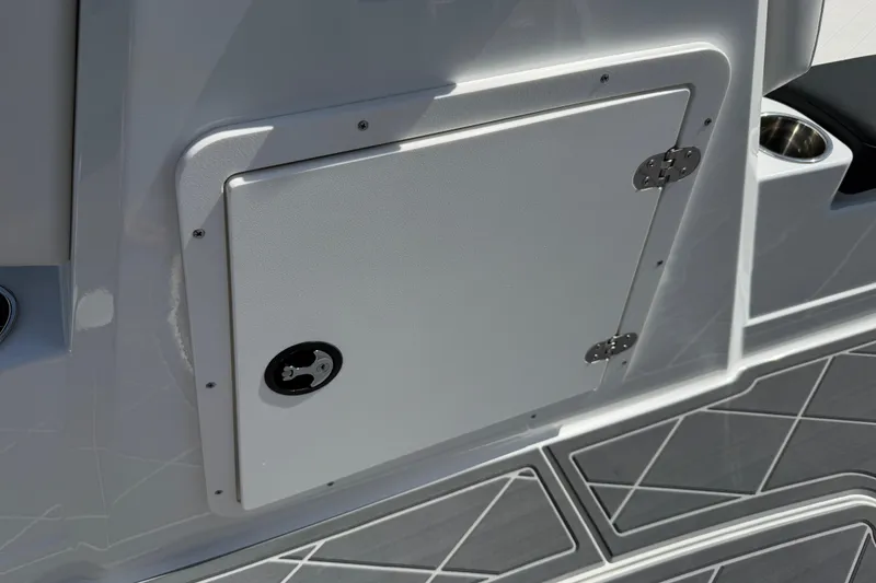 Slide: The Image of Compartment door on a 2021 Tahoe 1950 boat, featuring sleek design and secure latch. - 78