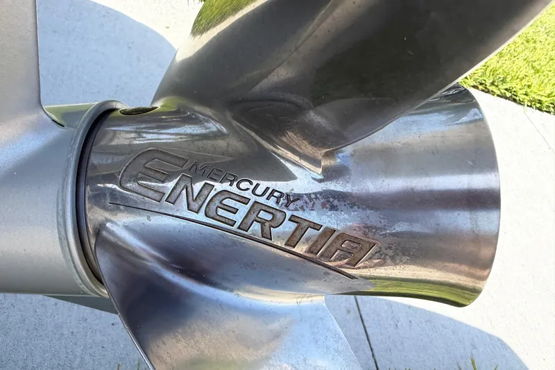 Slide: The Image of Close-up of a Mercury Enertia boat propeller, showcasing its metallic finish. - 10