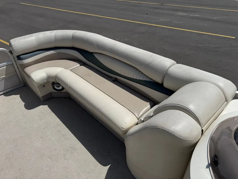 Slide: The Image of Bennington 2250RL 2007 boat seating parked on asphalt. - 11
