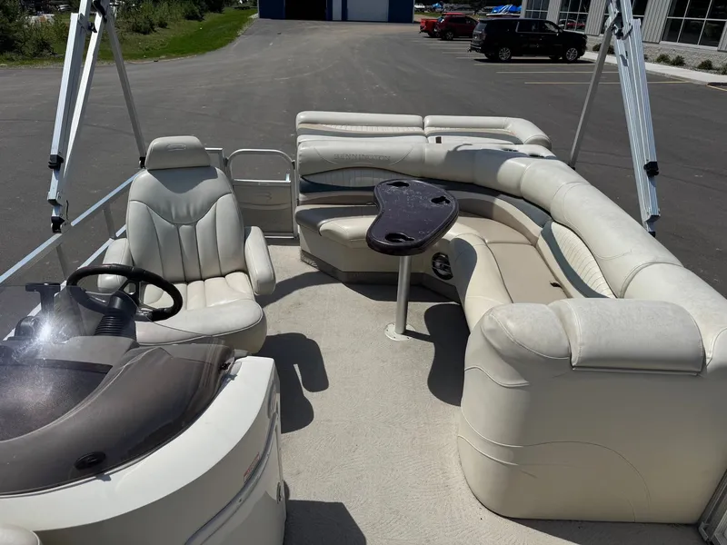 Slide: The Image of Interior of a 2007 Bennington 2250RL pontoon boat with seating area. - 13