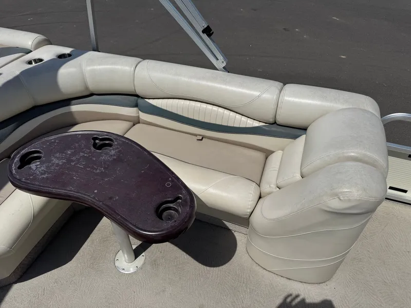 Slide: The Image of Interior of a 2007 Bennington 2250RL pontoon boat with seating and table. - 14