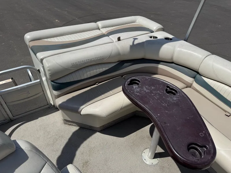 Slide: The Image of Interior of a 2007 Bennington 2250RL pontoon boat with seating and table. - 15