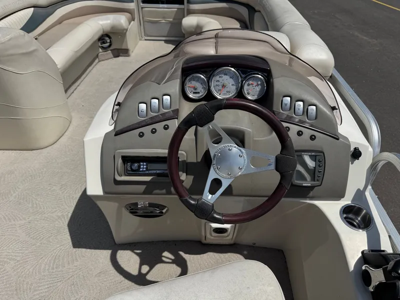 Slide: The Image of Interior view of a 2007 Bennington 2250RL boat with steering console. - 17